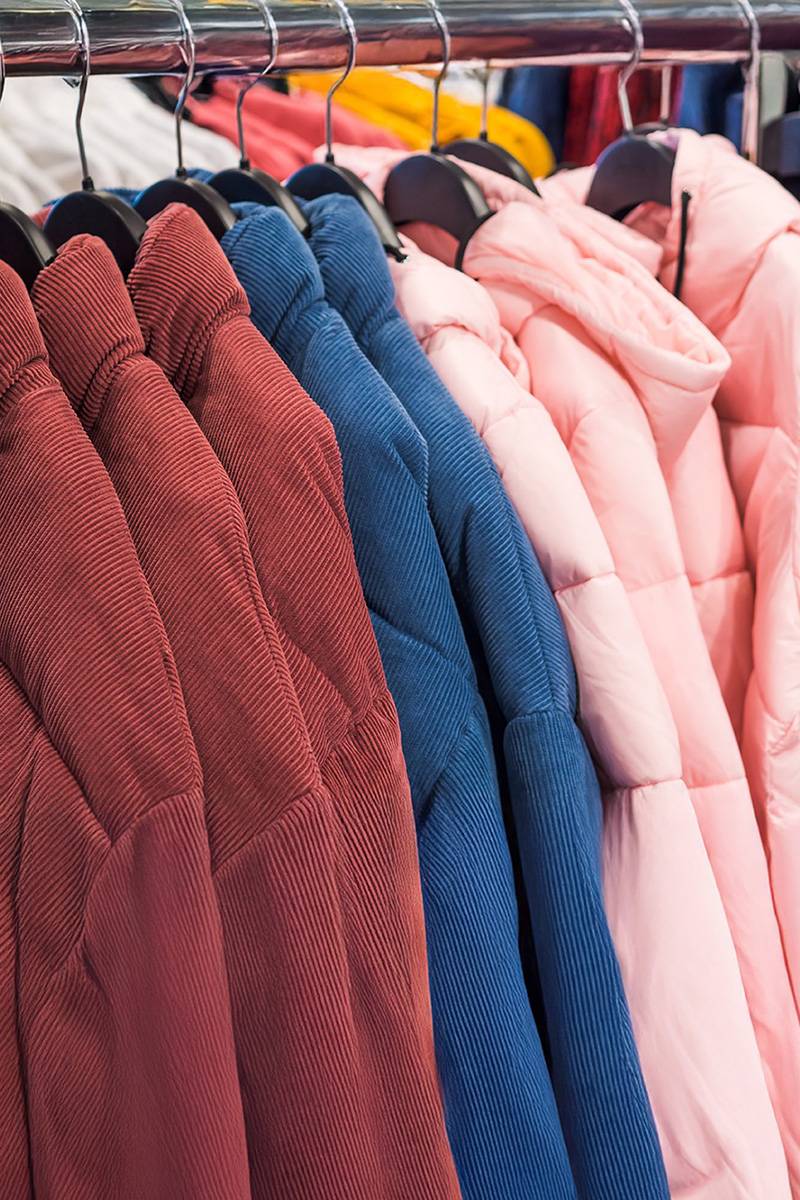 Outerwear jackets on hangers showcasing apparel manufacturing and sourcing quality